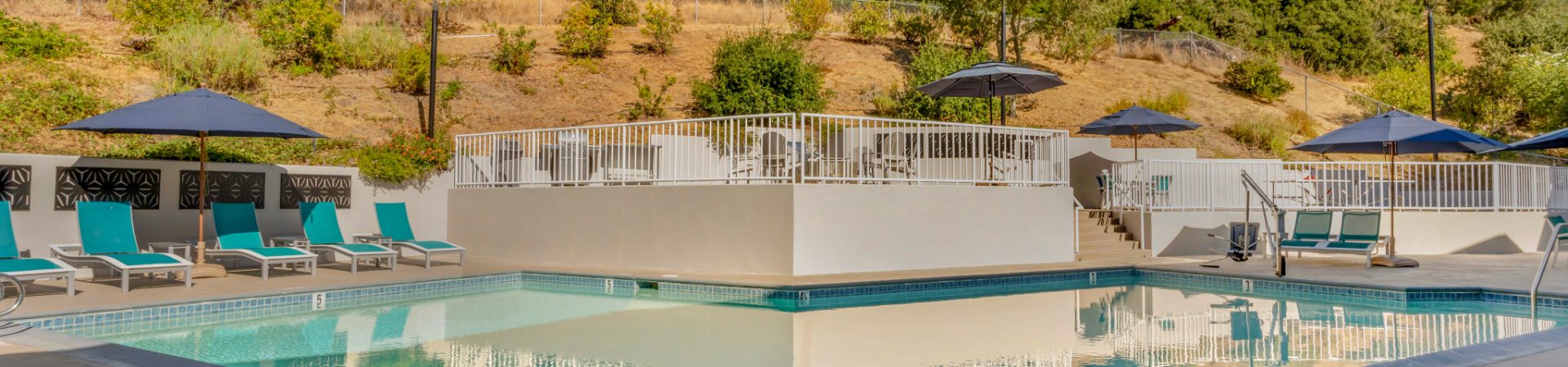 Outdoor pool with lounge chairs